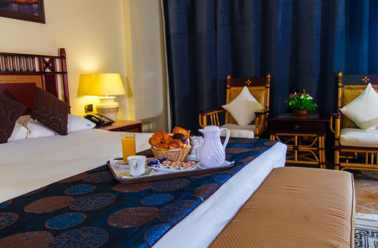 Jolie Ville Hotel & Spa Kings Island Luxor Buitenkant foto A room at the Nile Hilton